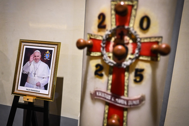 A photo of Pope Francis is shown on April 24, 2025, during a requiem Mass at the Jakarta Cathedral in Jakarta.
