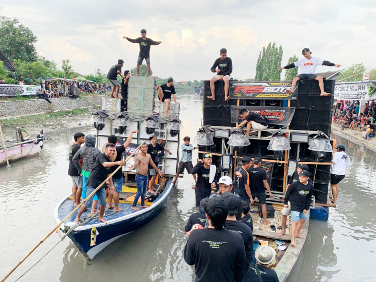 Boats carrying a sound system commonly known as horeg are seen on Feb. 15, 2025, during a sound system battle event during the pre-Ramadan Javanese festival of Nyadran in Sidoarjo, East Java.