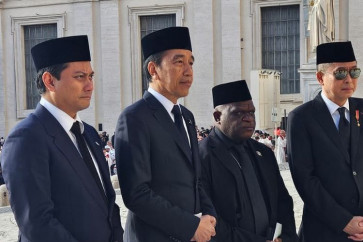 Former president Joko “Jokowi” Widodo (second left) and members of President Prabowo Subianto’s cabinet (from left), Deputy Finance Minister Thomas Djiwandono and Human Rights Minister Natalius Pigai, along with former energy minister Ignasius Jonan, arrive in the Vatican on April 25, 2025, to attend the funeral of Pope Francis on the following day on behalf of Prabowo.