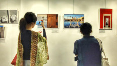 Glimpse of Italy: Two visitors are drawn in by Valerio Corzani’s photographs at the Geometria dell’Incanto: Frammenti di Bellezza Italiana exhibition at IIC Jakarta.