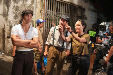 Guerilla warfare: Perang Kota cast members Chicco Jerikho (left) and Jerome Kurnia (center) are directed by Mouly Surya (right). The latter's previous directorial credits include the 2017 neo-Western thriller Marlina the Murderer in Four Acts. Courtesy of Cinesurya, Starvision and Kaninga Pictures