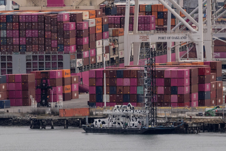 A cargo ship full of shipping containers is seen at the port of Oakland as trade tensions escalate over U.S. tariffs, in Oakland, California, United States on February 3, 2025. 