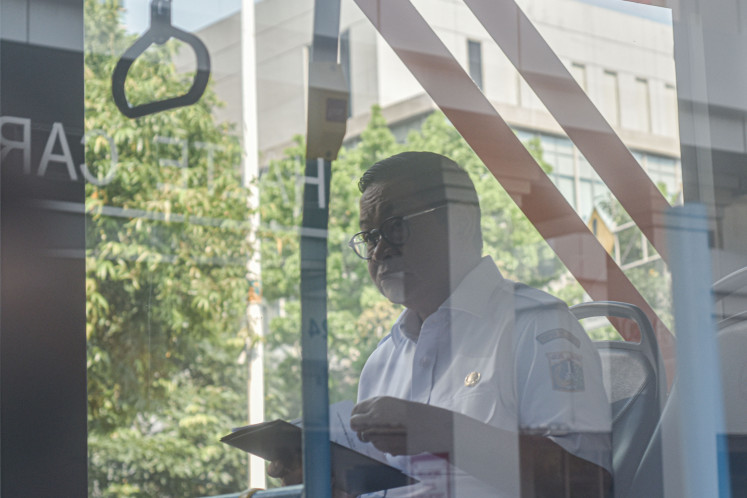 Leading by example: Jakarta Governor Pramono Anung rides a TransJakarta bus on Wednesday in Salemba, Central Jakarta. The city administration requires civil servants to use public transportation every Wednesday in accordance with Gubarnatorial Instruction (Ingub) No. 6/2025.