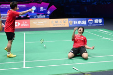 Japan's Takuro Hoki (left) and Yugo Kobayashi celebrate defeating Malaysias Aaron Chia and Soh Wooi Yik in their mens doubles match at the Sudirman Cup badminton championship in Xiamen, Chinas southeastern province on May 1, 2025. 