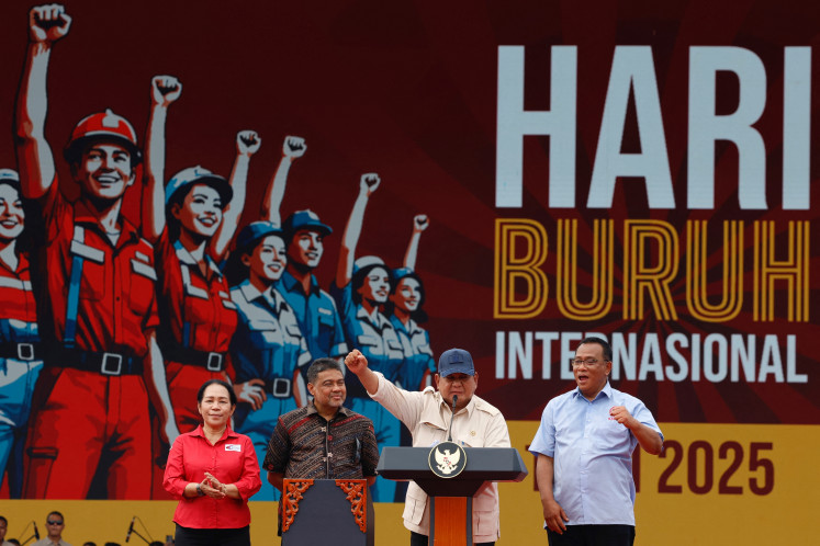 Addressing workers' welfare: President Prabowo Subianto (second right) delivers his speech on Thursday during a May Day rally in Jakarta.