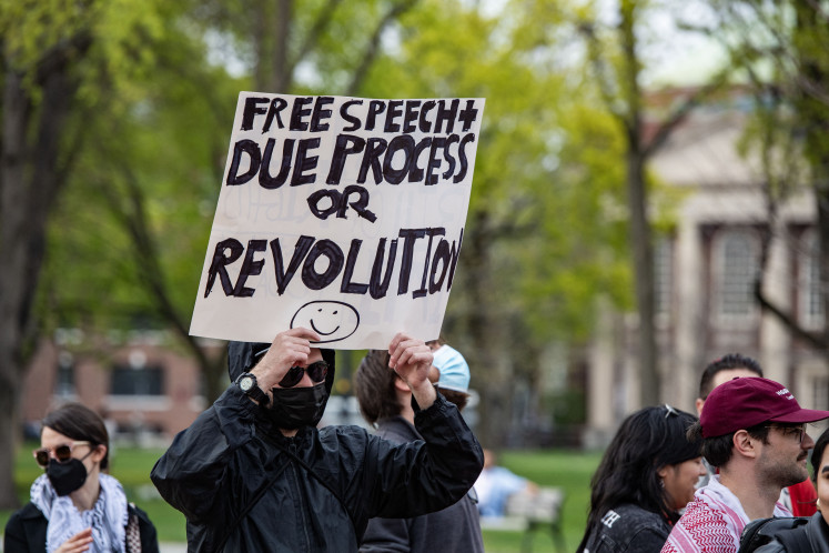 Demonstrators gather on Cambridge Common to protest Harvard's stance on the war in Gaza and show support for the Palestinian people, outside Harvard University in Cambridge, Massachusetts on April 25, 2025.