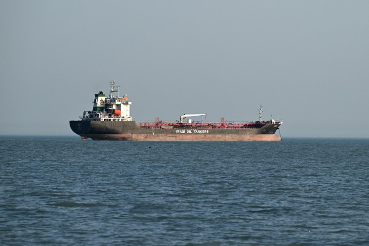 An Iraqi oil tanker waits at the Khawr Abd Allah canal leading up to Al-Faw port in southern Iraq, on June 6, 2024.