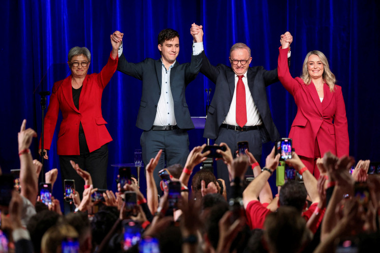 Australia's Prime Minister Anthony Albanese celebrates with his partner Jodie Haydon, his son Nathan Albanese and Minister for Foreign Affairs Penny Wong at a Labor party election night event, after local media projected the Labor Party's victory, on the day of the Australian federal election, in Sydney, Australia, May 3, 2025.