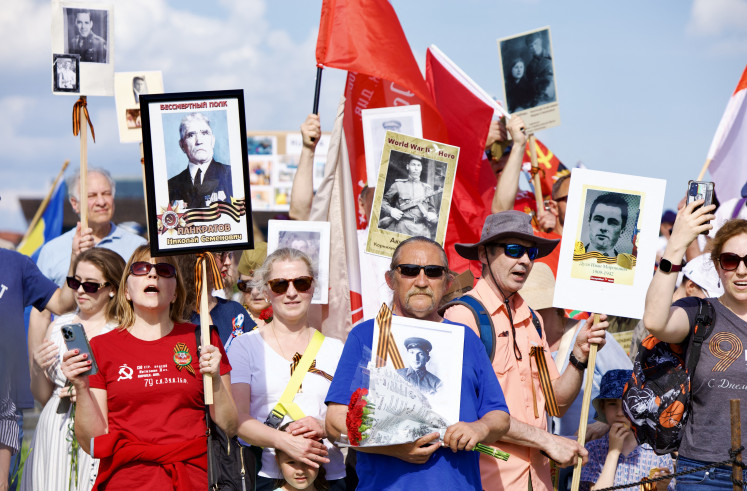 Russian activists take part in an “Immortal Regiment“ march on Saturday to mark the 80th anniversary of the end of the “Great Patriotic War", the Soviet victory over the Nazis in World War II, in Washington, DC. 