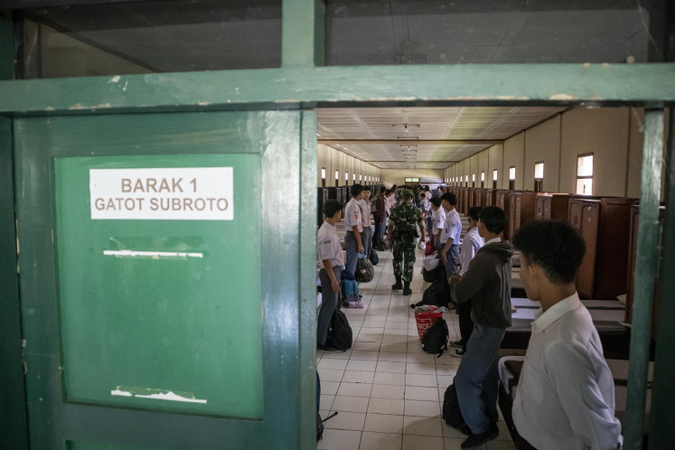 Students stand at the ready in a military barracks on Monday while undergoing an intensive character and discipline training at a military education center in West Bandung regency, West Java. Hundreds of students from various regions across West Java who were involved in street brawls and motorbike gangs or were addicted to online games are undergoing an intensive training program led by Indonesian Military (TNI) personnel for at least 14 days.