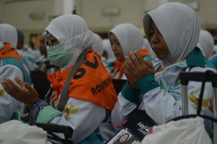 Haj pilgrims pray together for their safety  on May 1, 2025, during a sendoff ceremony at the Donohudan haj dormitory in Boyolali, Central Java.