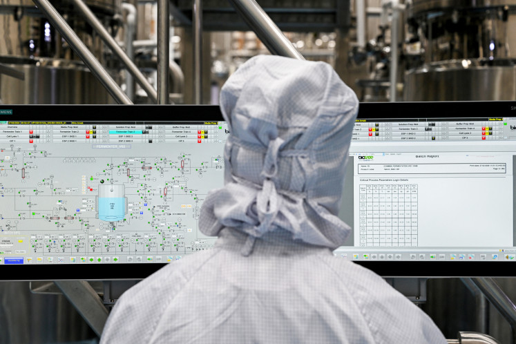 A scientist monitors a control panel inside the Human Papillomavirus (HPV) vaccine manufacturing unit of the Serum Institute of India (SII) at its headquarters in Hadapsar, Pune, on Feb. 27, 2024. 