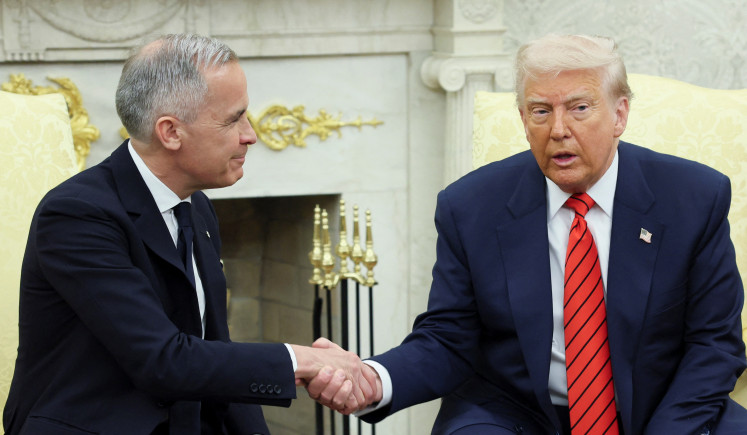 United States President Donald Trump and Canadian Prime Minister Mark Carney shake hands as they meet in the Oval Office at the White House in Washington, D.C. on May 6, 2025.