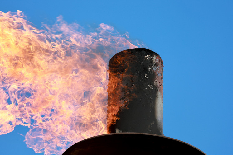 Natural gas is flared off during an oil drilling operation in the Permian Basin oil field on March 12, 2022 in Stanton, Texas. United States.
