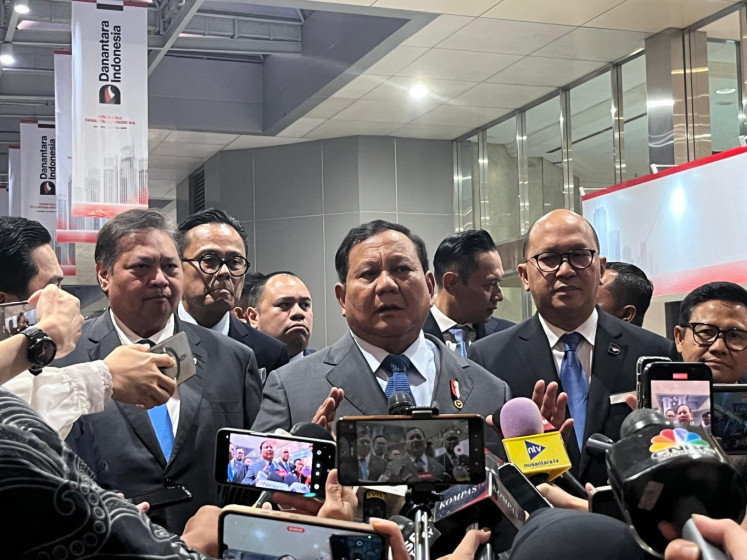Stern beginnings: President Prabowo Subianto (center) addresses reporters on Monday after Danantara’s first town hall meeting at the Jakarta Convention Center (JCC) in Senayan, Central Jakarta. 