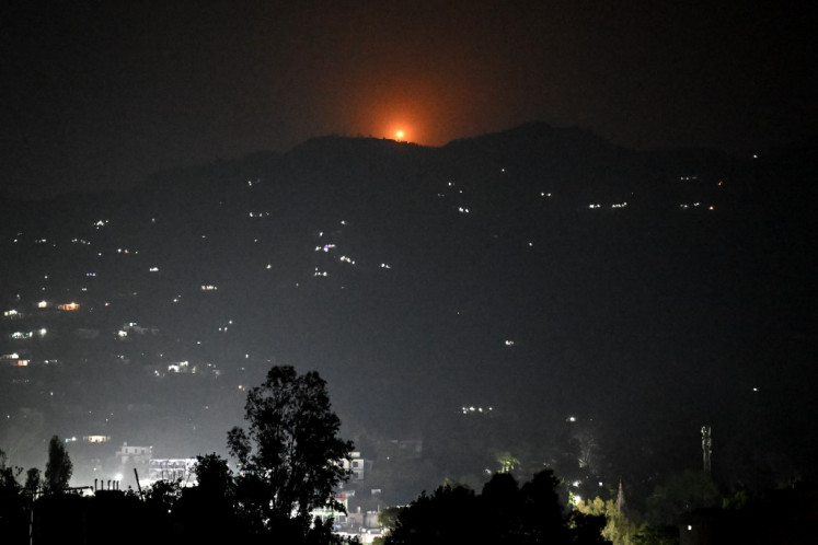 A flare goes up in air over the hill near main town of Poonch district, on May 7, 2025. India said on May 7 it carried out “precision strikes at terrorist camps“ inside Pakistan and Pakistani-controlled Kashmir, days after it blamed Islamabad for a deadly attack on the Indian side of the contested region. 