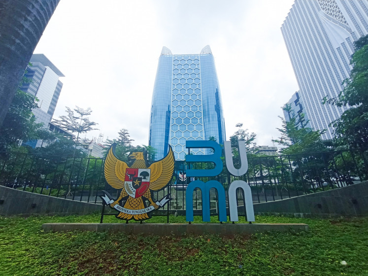 The logo of the State-Owned Enterprises (SOEs) Ministry is seen in front of the ministry's building in Jakarta on Jan. 1, 2025.