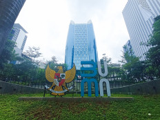 State-Owned Enterprises (SOEs) Ministry logo is seen on Jan. 1 in front of the ministry's building in Jakarta.