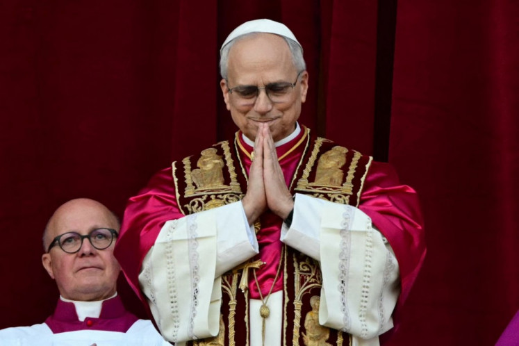 Newly elected Pope Leo XIV, Robert Prevost addresses the crowd from the main central loggia balcony of the St Peter's Basilica for the first time, after the cardinals ended the conclave, in The Vatican, on May 8, 2025. 