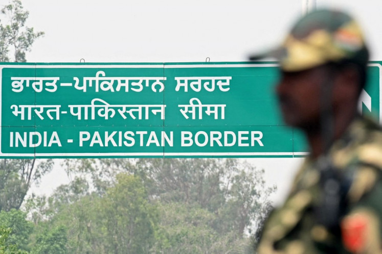 An Indian Border Security Force (BSF) soldier stands guard near the India-Pakistan Wagah border post, about 35 kilometers from Amritsar in India on May 9, 2025.