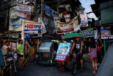 Philippines votes in high-stakes midterms amid Marcos-Duterte showdown