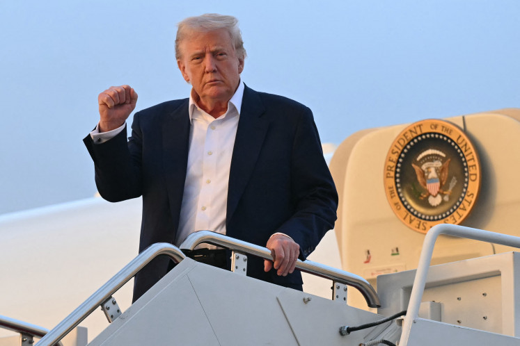 US President Donald Trump disembarks from Air Force One upon arrival at Joint Base Andrews in Maryland, May 4, 2025, as he returns to the White House after spending the weekend in Florida.