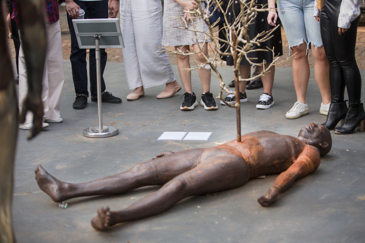 Forever Sleep, Even Though He Always Wakes Up by Asmudjo J. Irianto is part of a series of sculptures exploring humanity’s downfall through environmental destruction.