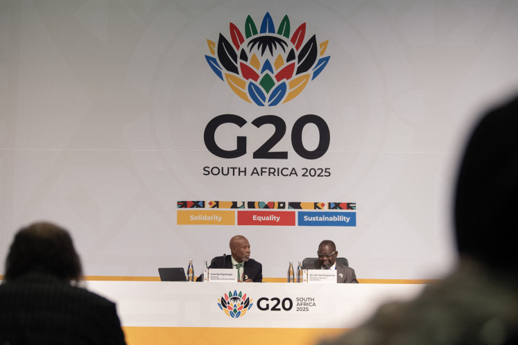 South African Minister of Finance Enoch Godongwana (right) and Governor of the South African Reserve Bank Lesetja Kganyago address the closing press conference of the G20 Finance and  Central Bank Ministers Meeting at the Cape Town International Convention Centre (CTICC) in Cape Town on Feb. 27.