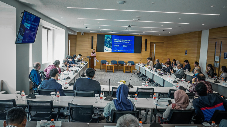 Participants attend the East Asia Media Caucus, organized by the Economic Research Institute for ASEAN and East Asia (ERIA) as a platform to strengthen cooperation between journalists, policymakers and researchers, on May 9, 2025, at ERIA’s offices in Tanah Abang, Central Jakarta.