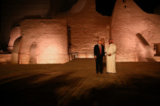 US President Donald Trump and Saudi Crown Prince Muhamad bin Salman arrive for a visit in the old district of Diriyah on the outskirts of the Saudi capital Riyadh, on May 13, 2025. 
