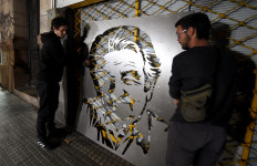 Two men paint the image of late Uruguay's President Jose Mujica in a wall in Montevideo on May 13, 2025. Uruguay's former president Jose Mujica, a former guerrilla fighter and icon of the left in Latin America, died at the age of 89 on May 13, 2025, the government announced. The farmer dubbed the “world's poorest president“ during his presidency for his modest lifestyle had been diagnosed with cancer of the esophagus in May 2024.