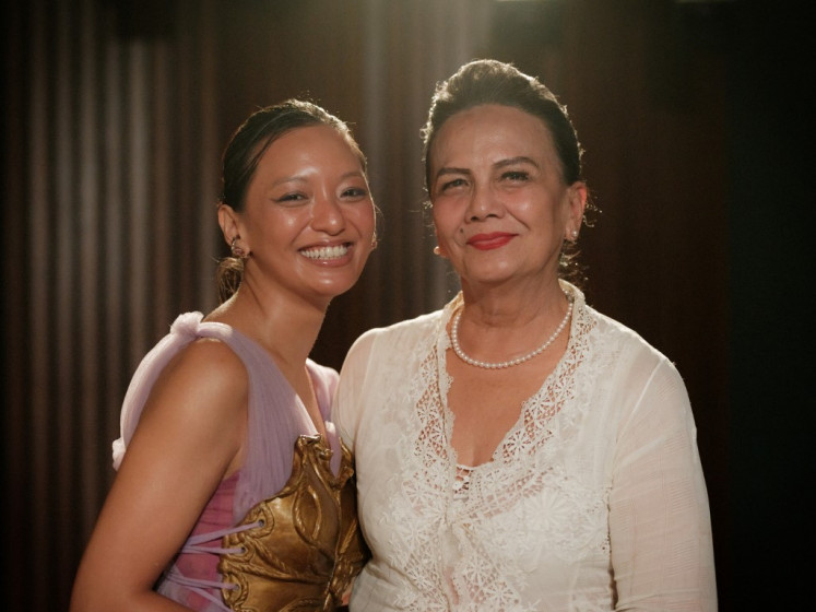 Actress and producer Christine Hakim (right) and actress Asmara Abigail pose after an interview with AFP at the Institut Francais Indonesie in Jakarta on May 5, 2025. 