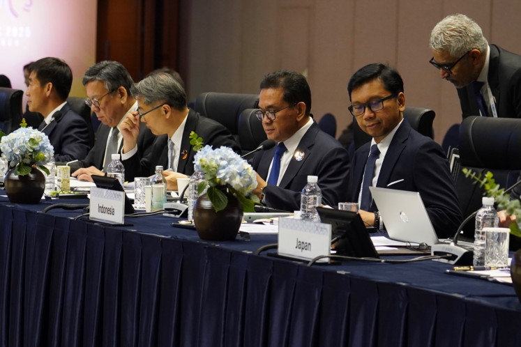 Trade Minister Budi Santoso (second right, seated) and his director general of international trade negotiations, Djatmiko Bris Witjaksono (right, seated), attend a session of the Asia-Pacific Economic Cooperation Ministers Responsible for Trade (MRT) Meeting on May 15, 2025, at the International Convention Center Jeju in Jeju, South Korea.