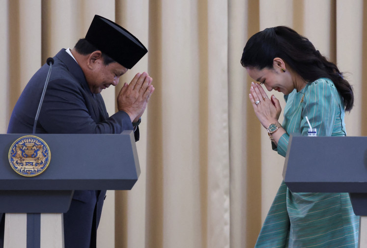 President Prabowo Subianto and Thailand's Prime Minister Paetongtarn Shinawatra bow to one another as they attend a press conference at the Government House, in Bangkok on May 19.