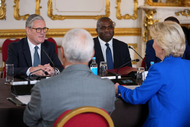 Britain’s Prime Minister Keir Starmer and Foreign Secretary David Lammy listen to European Commission President Ursula von der Leyen, and European Council President Antonio Costa, during a meeting between the UK and the European Union to discuss closer ties in their first official summit since Brexit, in London, Britain on May 19, 2025.