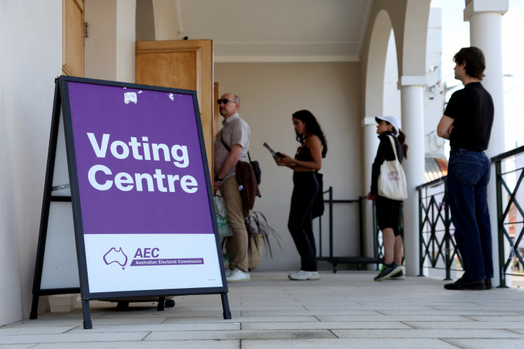 People queue outside a voting center during the Australian federal election, in Sydney, Australia on May 3, 2025.