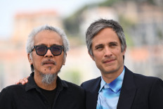 Mexican actor Gael Garcia Bernal and Filipino director,screenwriter and cinematographer Lav Diaz pose during a photocall for the film “Magalhaes“ (Magellan) at the 78th edition of the Cannes Film Festival in Cannes, southern France, on May 19, 2025. 