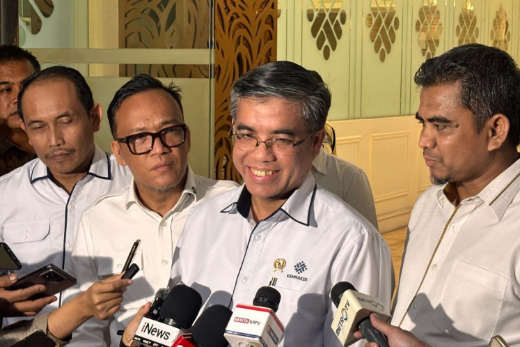 Manpower Minister Yassierli (second right) talks to reporters at the Manpower Ministry on Jl. Gatot Subroto in South Jakarta on May 20, 2025. Yassierli said he had dismissed officials implicated in a KPK raid relating to a corruption case involving the foreign worker utilization plan (RPTKA).