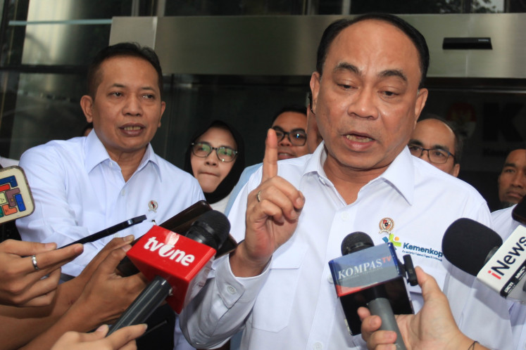 Cooperatives Minister Budi Arie Setiadi (right) and Deputy Minister Ferry Juliantono (left) talk to journalists following a meeting with the Corruption Eradication Commission (KPK) commissioners at the antigraft body headquarters in Jakarta on May 21. During the meeting, the minister request the KPK to help in preventing corruption from marring the Red and White village cooperative initiative, one of President Prabowo Subianto's flagship program.