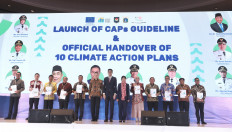 European Union Ambassador to Indonesia and Brunei Darussalam Denis Chaibi (center left), the United Cities and Local Governments of Asia- Pacific (UCLG ASPAC) Dakila Carlo E. Cua (center) and  UCLG ASPAC Secretary-General Bernadia Irawati Tjandradewi are flanked on Wednesday by mayors from 10 Indonesian cities receiving Climate Action Plans (CAP) in Jakarta. The handover was held during the Climate Resilience and Innovation Forum (CRIF) organized by UCLG ASPAC in cooperation with Jakarta city administration and the EU.
