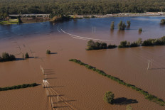 A drone view shows a boat at a flooded stud farm near the Hunter River in Heatherbrae, Australia on May 24, 2025.