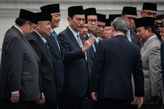 Visiting Chinese Premier Li Qiang (front, second right) greets National Economic Council (DEN) chairman Luhut Binsar Pandjaitan and other ministers with President Prabowo Subianto during a welcoming ceremony at the State Palace in Jakarta on May 25, 2025.
