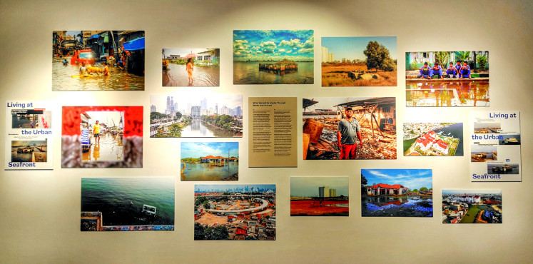 Worth a thousand words: The final panel of the "Living at Urban Seafront" exhibition showcases a mosaic of resilience. Displayed in a French salon-style wall, these photographs capture how Indonesian communities adapt to waterlogged environments in everyday acts of survival.