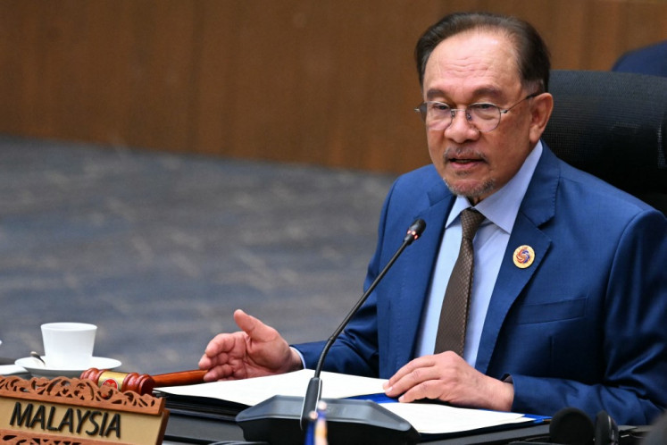 Malaysia's Prime Minister Anwar Ibrahim speaks during the plenary session at the 46th Association of Southeast Asian Nations (ASEAN) Summit in Kuala Lumpur on May 26, 2025. 