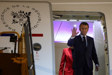 Macron's office downplays plane incident with wife