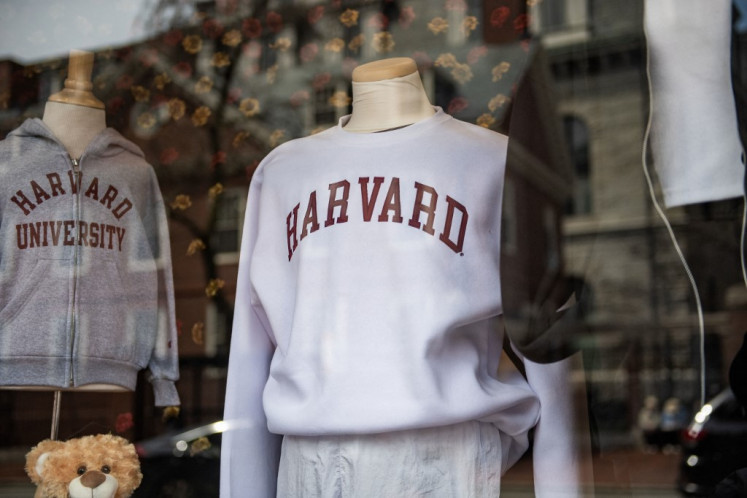 Harvard sweatshirts are displayed for sale in a school store window on the Harvard University campus in Cambridge, Massachusetts, the United States on April 15, 2025. US President Donald Trump's administration revoked Harvard's right to enroll foreign students, more than a quarter of its annual enrollment, in a major escalation of the president's fight with one of the world's most storied universities. 