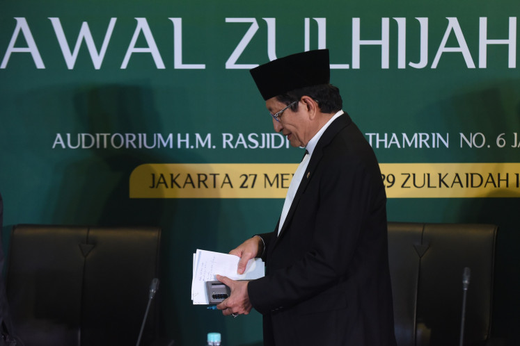 Religious Affairs Minister Nasaruddin Umar leaves his chair after a press briefing to announce the start of the Dzulhijja month in the Hijriah Islamic calendar at the Religious Affairs Ministry's office in Jakarta on May 27, 2025. The government declared the start of Dzulhijja falls on May 28 and the Idul Adha holiday on June 6.