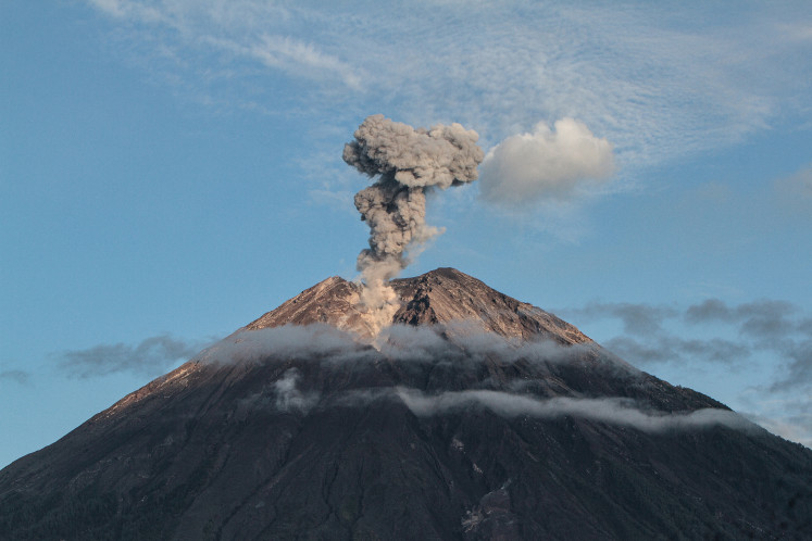 This picture taken on Dec. 17, 2022, shows Mount Semeru spewing thick smoke and hot lava in Lumajang, East Java.