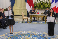 Imelda Tanoto, Managing Director at RGE (right) and Helle Kristoffersen, President Asia and Member of the Executive Committee at TotalEnergies (left) announced a Co-Investment Agreement between RGE and TotalEnergies in the presence of Indonesian President Prabowo Subianto and French President Emmanuel Macron at the Presidential Palace in Jakarta on Wednesday, 28 May 2025. The Co-Investment Agreement outlines the joint development of a solar power plant and battery energy storage project in Indonesia. 