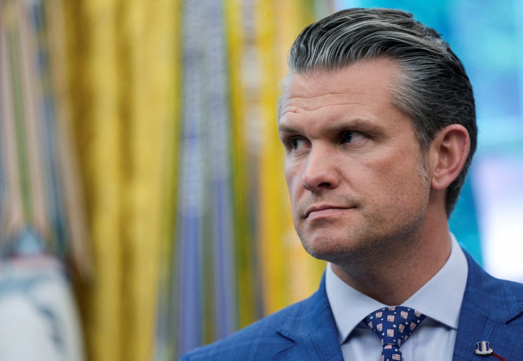 US Defense Secretary Pete Hegseth looks on as he attends the signing of an executive order by US President Donald Trump, at the White House in Washington, D.C. on May 23, 2025. 